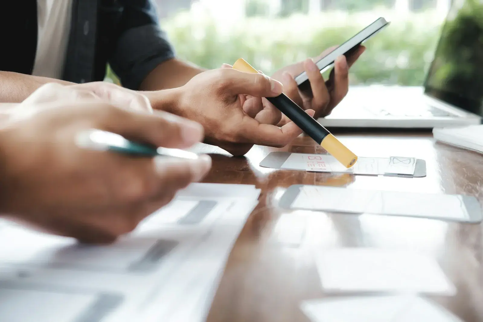 People's hands in a meeting